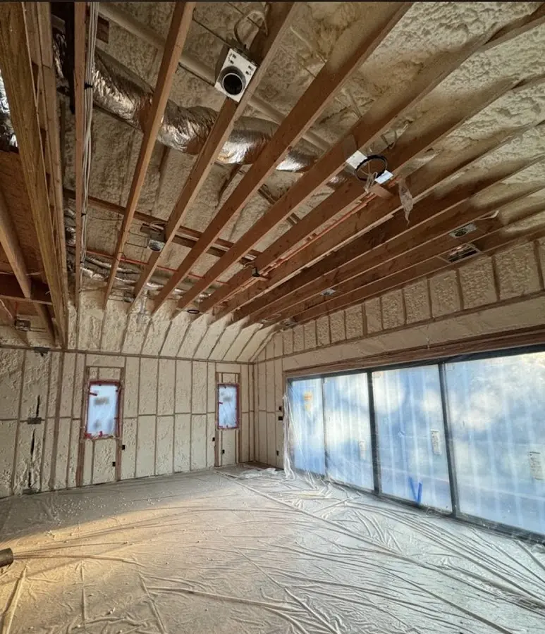 Interior walls and ceiling insulated with spray foam during new construction in Pikesville